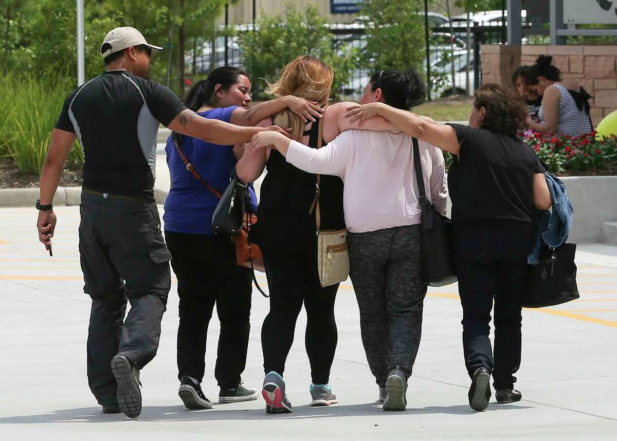 Family members of the three-year-old Ezra Parrish embracing and comforting Ezra's cousin, Lalaine Dungca, center, as they arrive at Texas Children's Hospital The Woodlands with relief of Ezra was found safe Sunday, May 28, 2017, in Conroe. Ezra went missing from a family camping trip at the Sam Houston National Forest Saturday afternoon, and Dungca, who is visiting from California, found him in the forest Sunday afternoon. ( Yi-Chin Lee / Houston Chronicle )