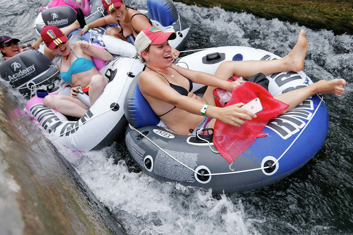 Tubers enjoy the tube chute in Prince Solms Park on the Comal River Sunday May 28, 2017 in New Braunfels, Tx.