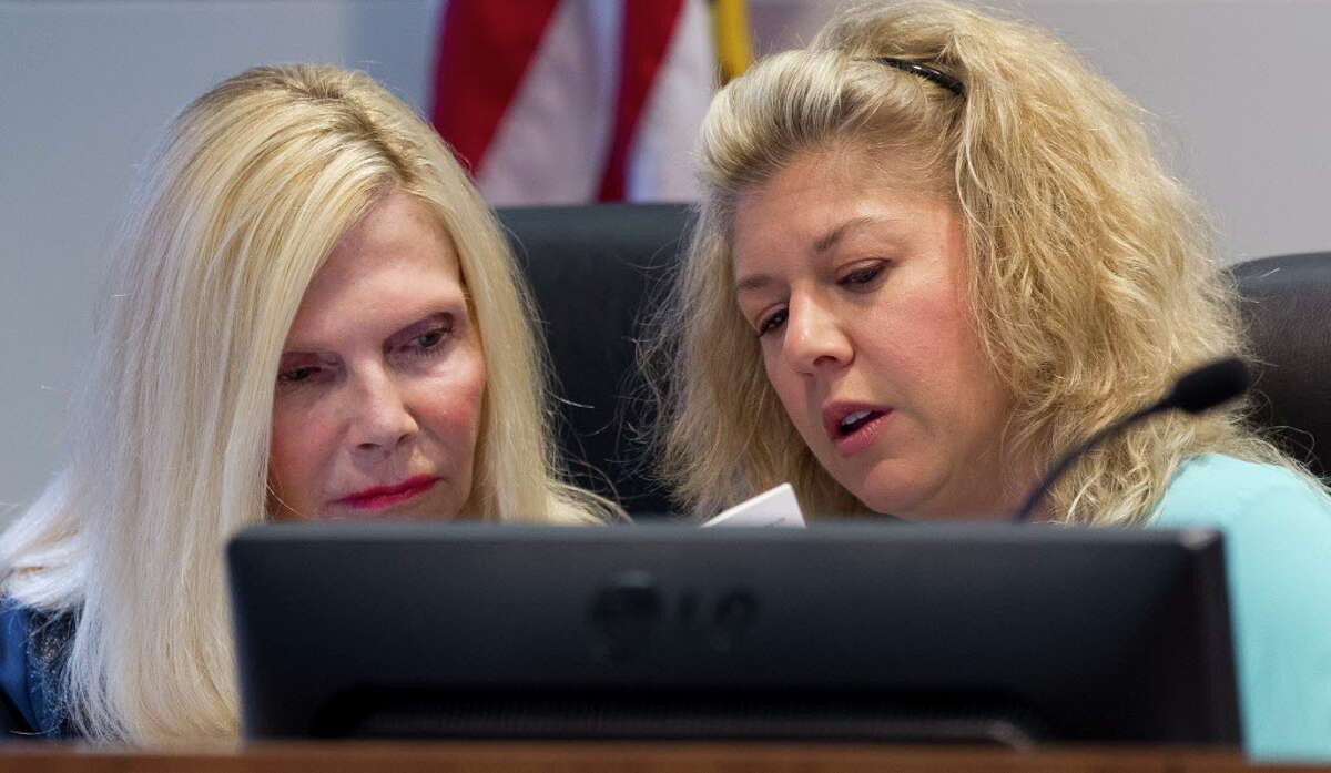Ann Snyder, left, and Laura Fillault with The Woodlands Township Board of Directors are seen during a meeting April 26 in The Woodlands. Fillault is spearheading a Sept. 11 remembrance event.
