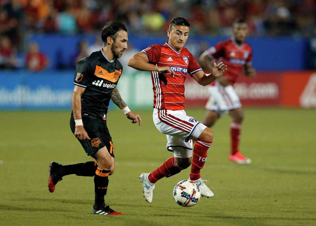 Houston Dynamo forward Vicente Sanchez (10) and FC Dallas midfielder Mauro Diaz, right, compete for control of the ball in the second half of an MLS soccer game, Sunday, May 28, 2017, in Frisco, Texas. (AP Photo/Tony Gutierrez)
