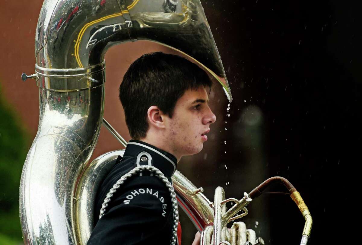 Rain drops fall off the tuba of a member of the Mohonasen Marching Band from Rotterdam during the Albany Memorial Day Parade on Monday, May 29, 2017, in Albany, N.Y. (Paul Buckowski / Times Union)