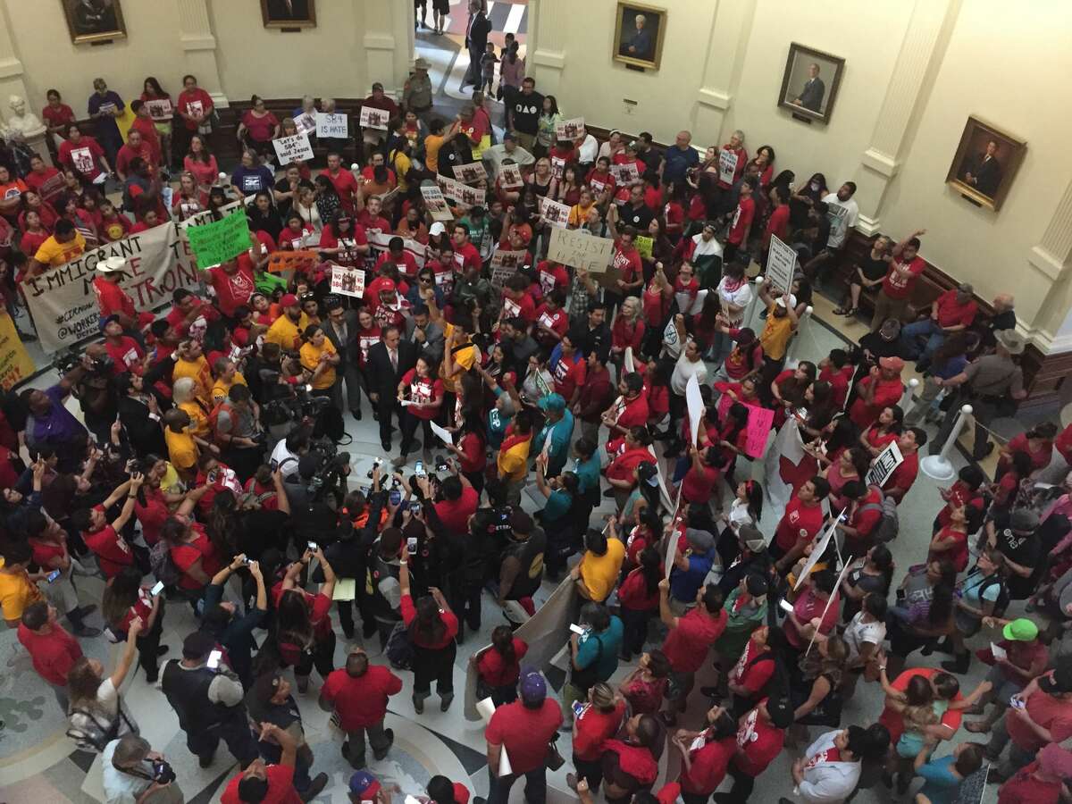 Protesters gather in the Texas Capitol on Monday, May 29, 2017 to protest the "sanctuary cities" law.