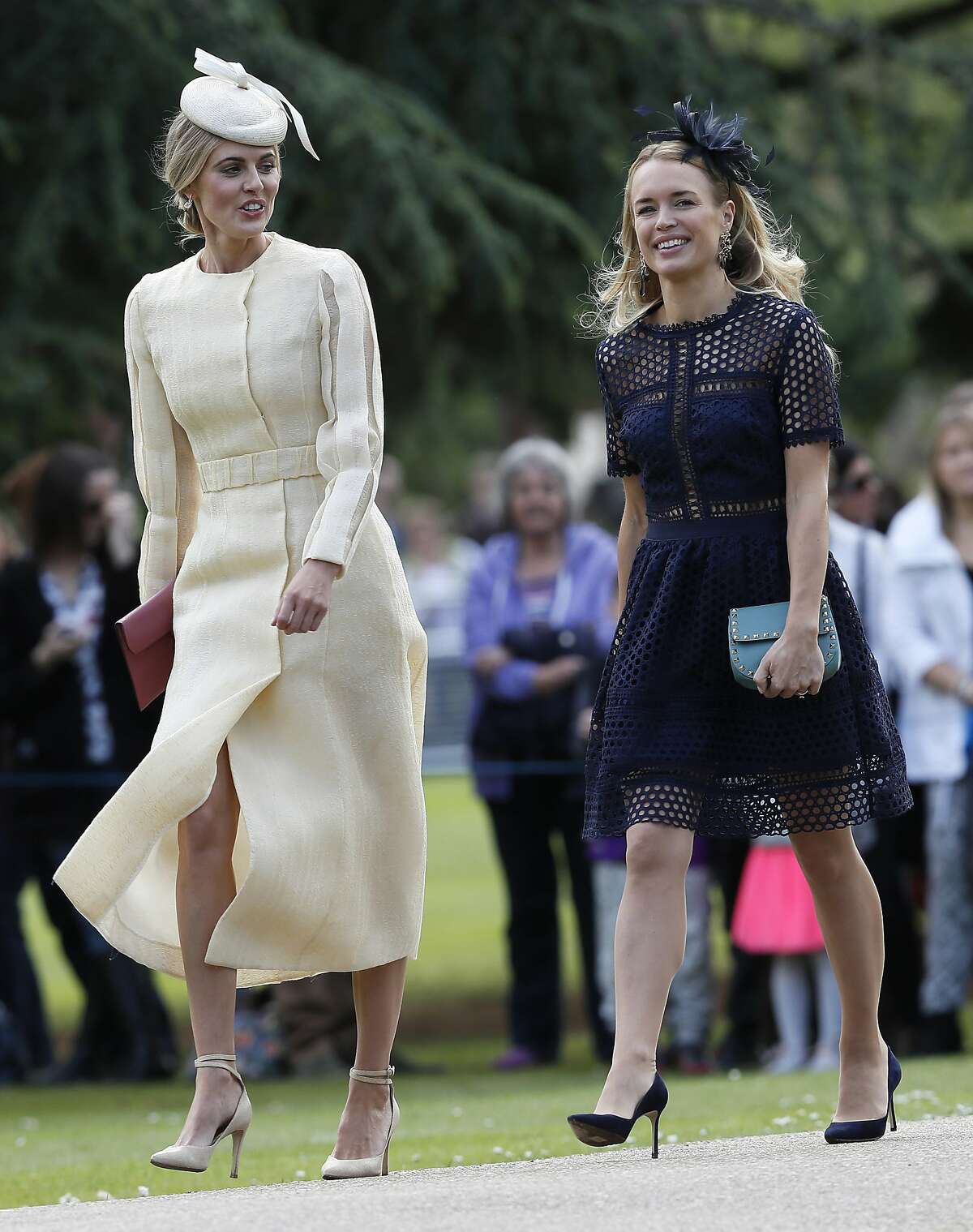 Donna Air, left, arrives at St Mark's Church in Englefield, England, ahead of the wedding of Pippa Middleton and James Matthews, Saturday, May 20, 2017. Middleton, the sister of Kate, Duchess of Cambridge is to marry hedge fund manager James Matthews in a ceremony Saturday where her niece and nephew Prince George and Princess Charlotte are in the wedding party, along with sister Kate and princes Harry and William. (AP Photo/Kirsty Wigglesworth, Pool)