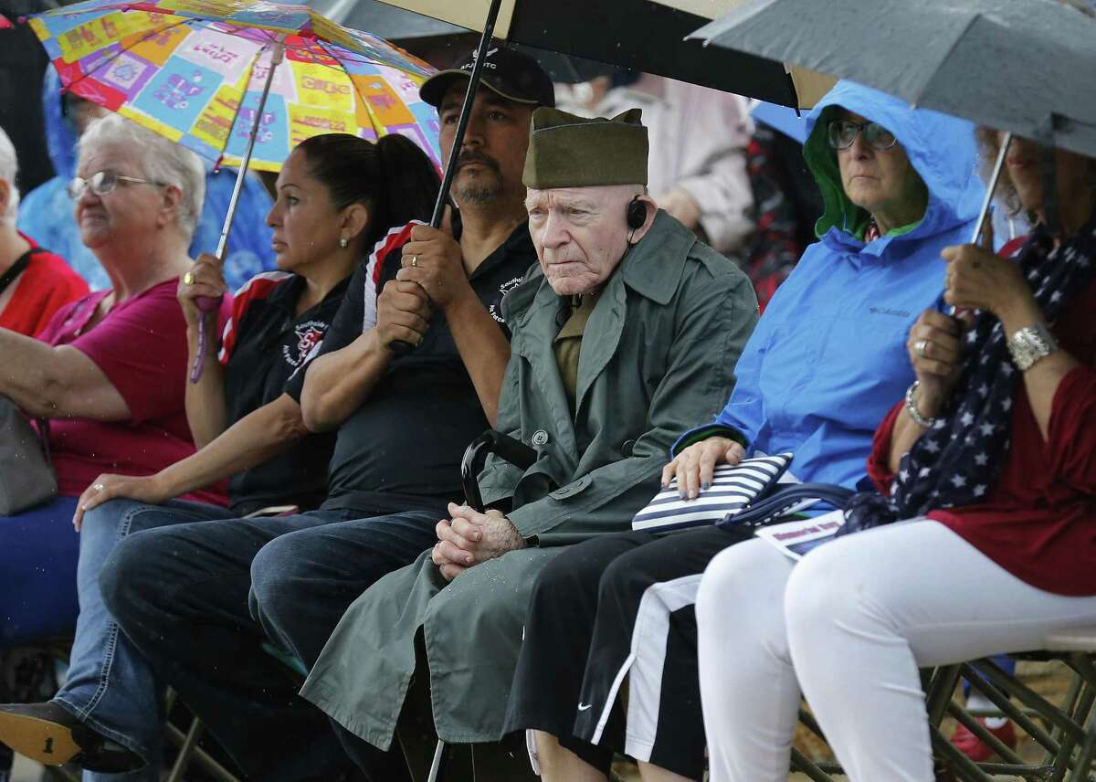 Korean War veteran Sgt. James Francis Joseph Gerard (center) wears his Army uniform while attending the Memorial Day ceremony at Fort Sam Houston National Cemetery on Monday, May 29, 2017. (Kin Man Hui/San Antonio Express-News)