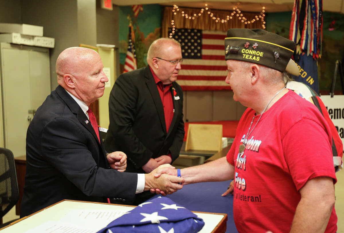 U.S. Rep. Kevin Brady, R-The Woodlands, shakes hands with veteran Michael Day, right, during the Memorial Day Ceremony on Monday, May 29, 2017, at Conroe VFW Post 4709.