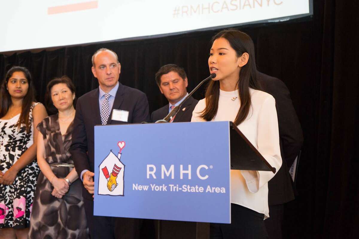 Westhill High School senior Dong Zhi Guo, right, addresses the audience at a Manhattan hotel on May 19 after receiving a scholarship through the 2017 Ronald McDonald House Charities’ ASIA Scholarship Program.