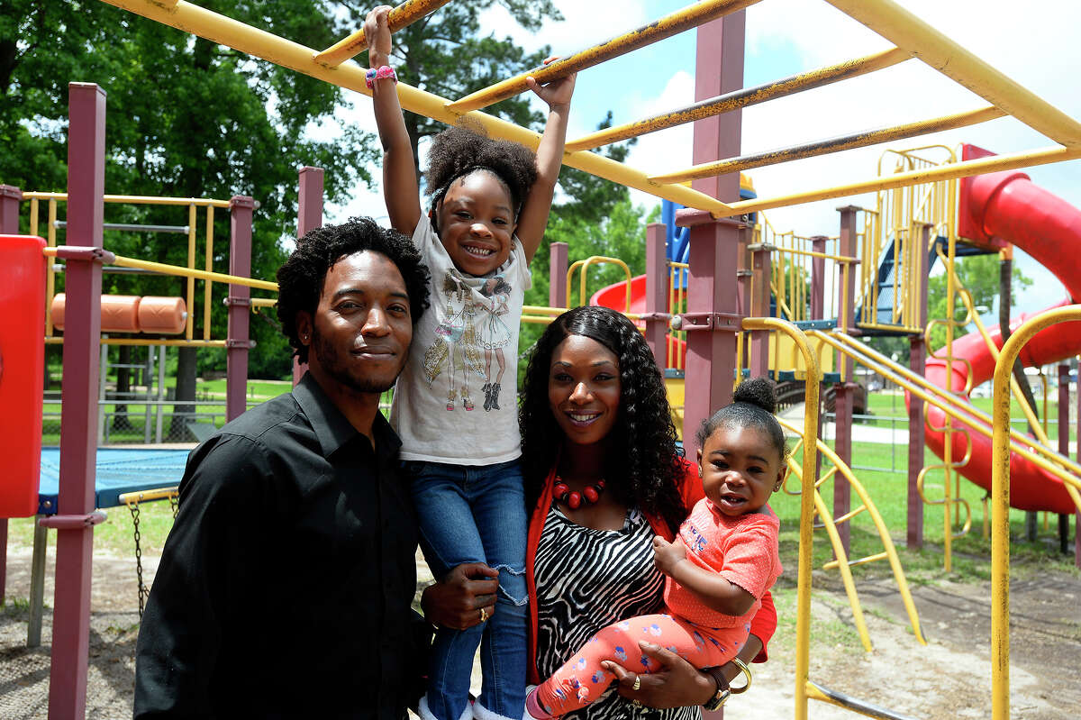 Jasper city councilman Rashad Lewis poses with his wife, Ronzie, and daughters Zoe, 3, and Riley, 1, at the city's Sandy Creek Park. Lewis hopes to bring more things to help the city's youth. Photo taken Tuesday 5/23/17 Ryan Pelham/The Enterprise