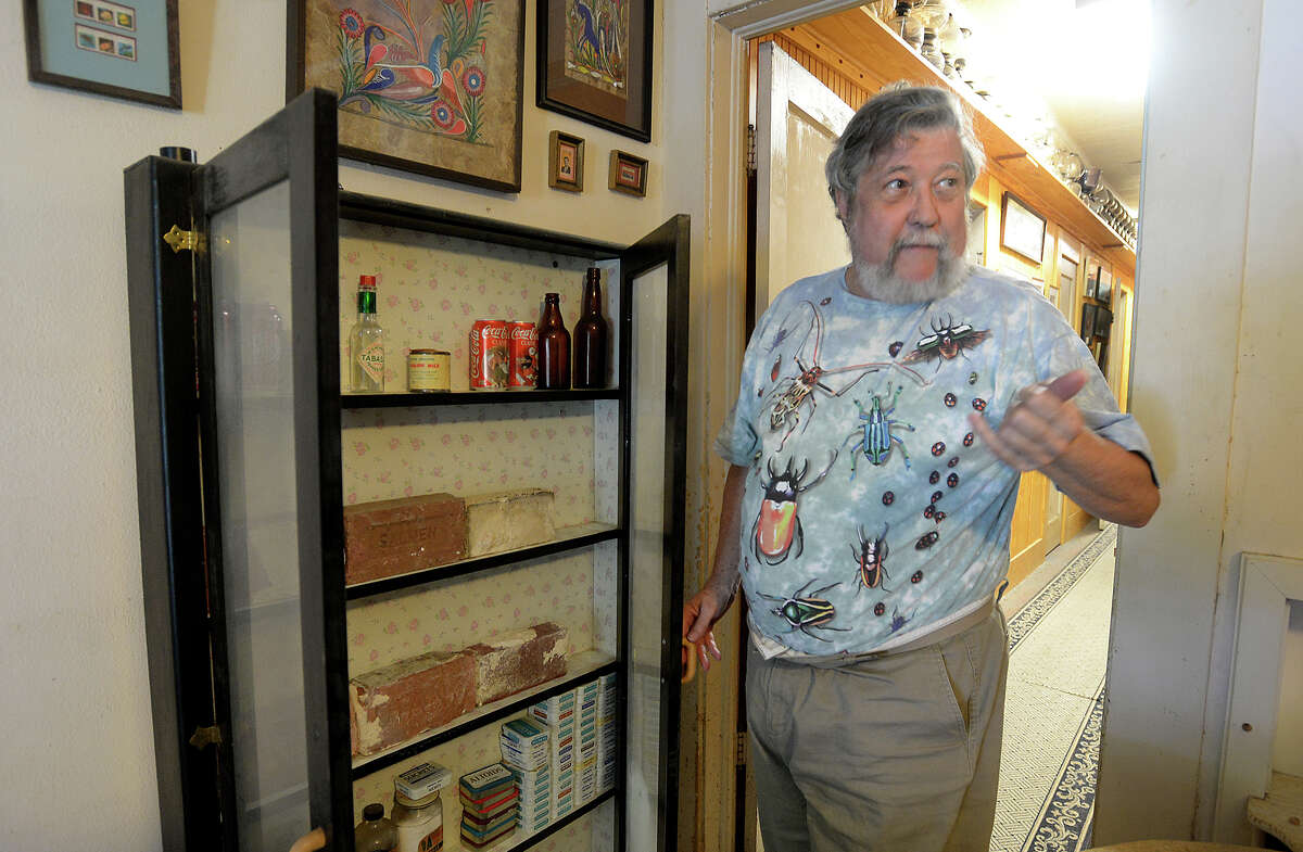 Steven Lewis shows Friday his collection of bricks from six Beaumont buildings that have been razed. Lewis' display of photos comparing modern Beaumont to its historic counterpart will be on display at Lamar onTuesday. Photo taken Friday, May 26, 2017 Guiseppe Barranco/The Enterprise