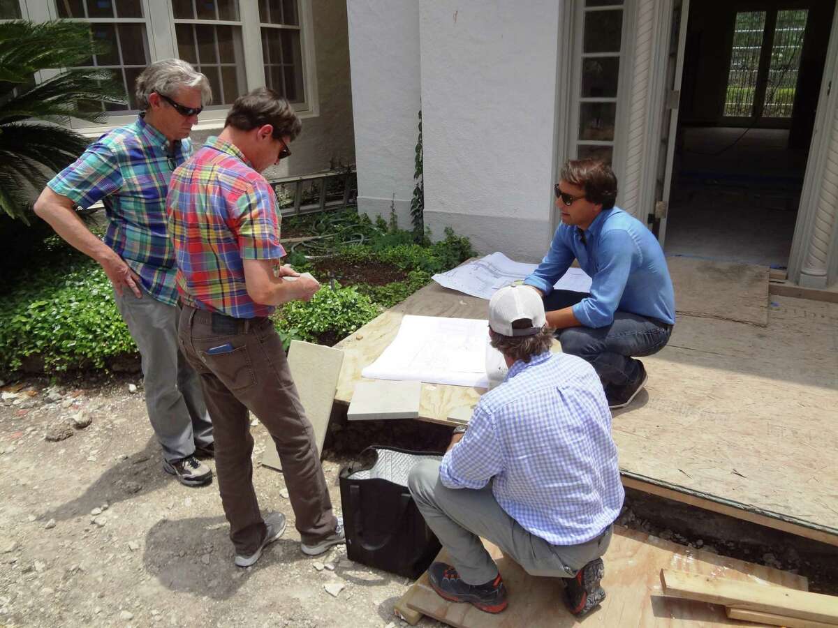 Homeowners Dennis Karbach and Robert Kevin Brown (left) talk about Lueders limestone samples for pool coping with Cameron Campbell of Ten Eyck Landscape Architects (top) and Brad Sharpe of San Antonio’s Brad Sharpe Pools.