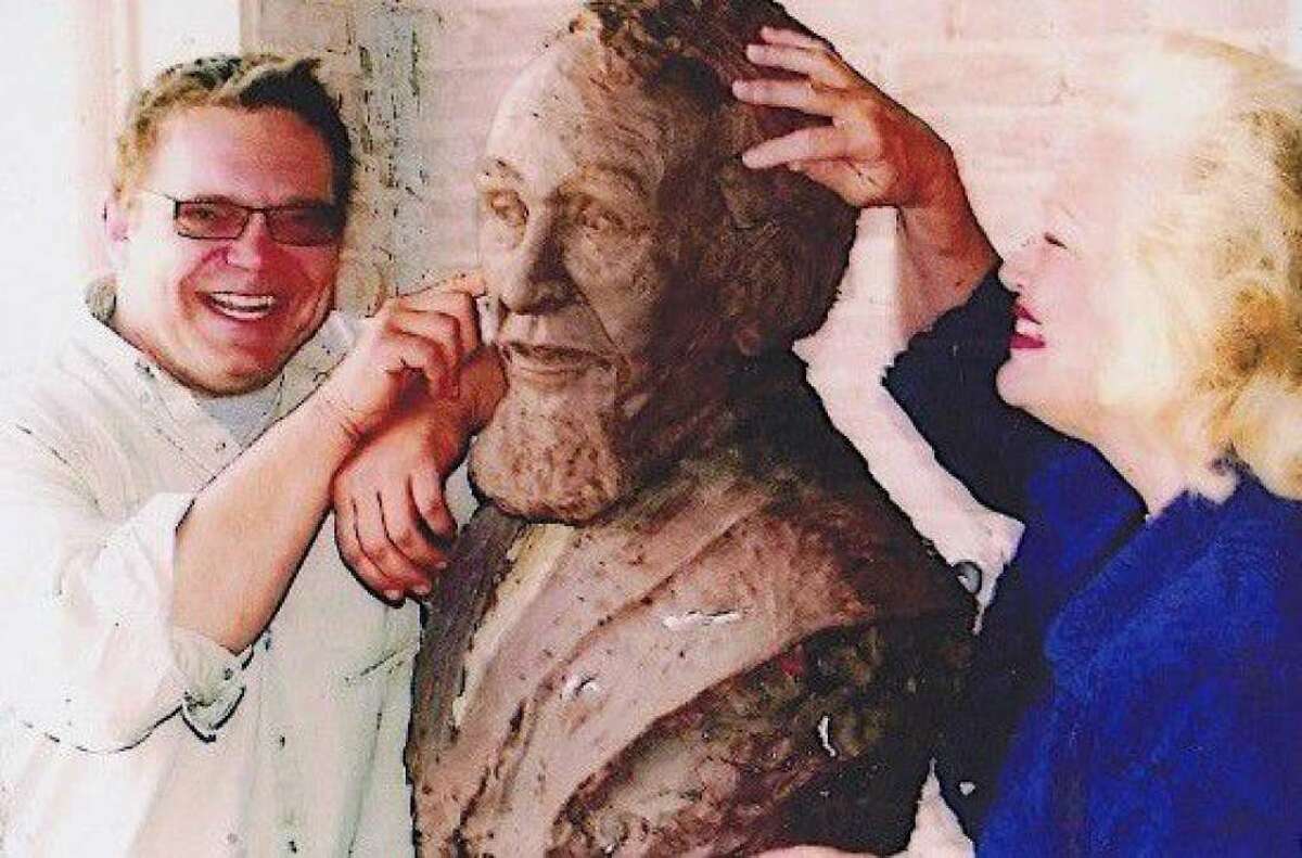 Artist Craig Campobella, left, sculpted a bust of Dr. Charles B. Stewart at a studio in downtown Conroe. Great-great-great granddaughter of Charles B. Stewart, Pat Spackey, right, viewed the bust in production and was able to include a piece of clay to Stewartâs ear. The bust is at The Lone Star Monument and Historical Flag Park.