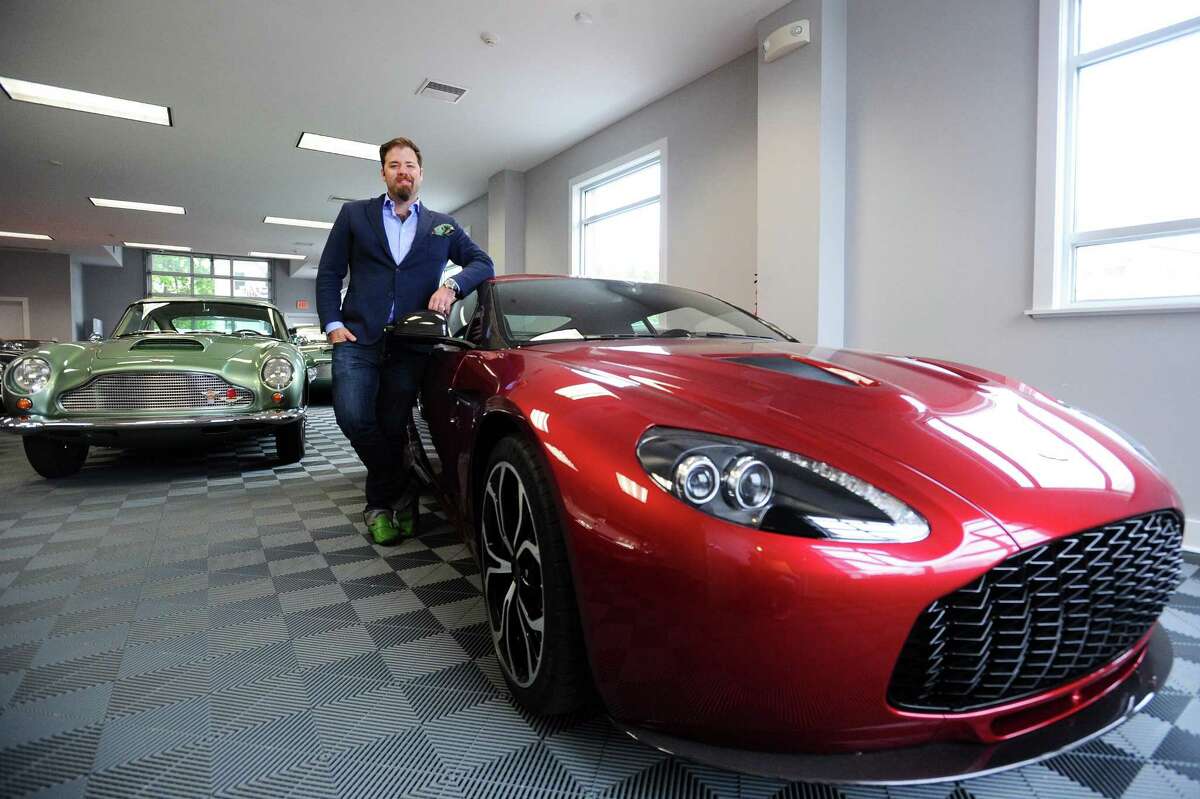 Matthew Ivanhoe, president of the Cultivated Collector, next to a 2012 Aston Martin V12 Vantage Zagato inside his Vitti Street showroom and club in New Canaan on Thursday. Only 64 2012 Aston Martin V12 Vantage Zagatos were made.