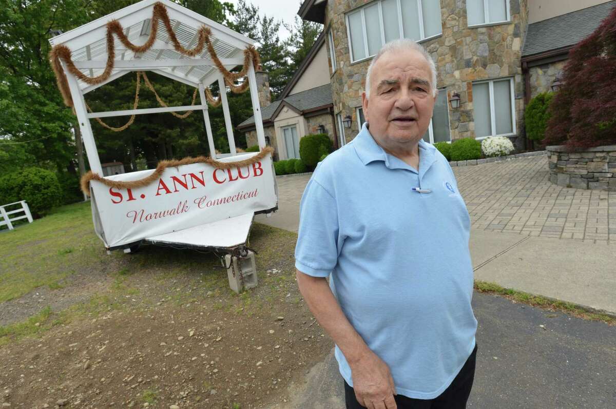 St. Ann Club President Nicandro Cappuccia in front of the clubs float on Tuesday in Norwalk. The float was ready for the Norwalk Memorial Day parade on Monday, but due to bad weather the parade was canceled