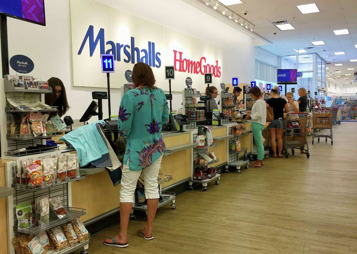 In this Monday, May 15, 2017, photo, shoppers pay for their purchases at a Marshalls & Home Goods retail store, part of the TJX Companies brand, in Phoenix. Americans increased their spending in April at the fastest pace in four months, bolstered by a solid gain in incomes, according to information released Tuesday, May 30, 2017, by the Commerce Department. The strong results underscored expectations that the economy is poised to rebound after a lackluster start to the year. (AP Photo/Ross D. Franklin)