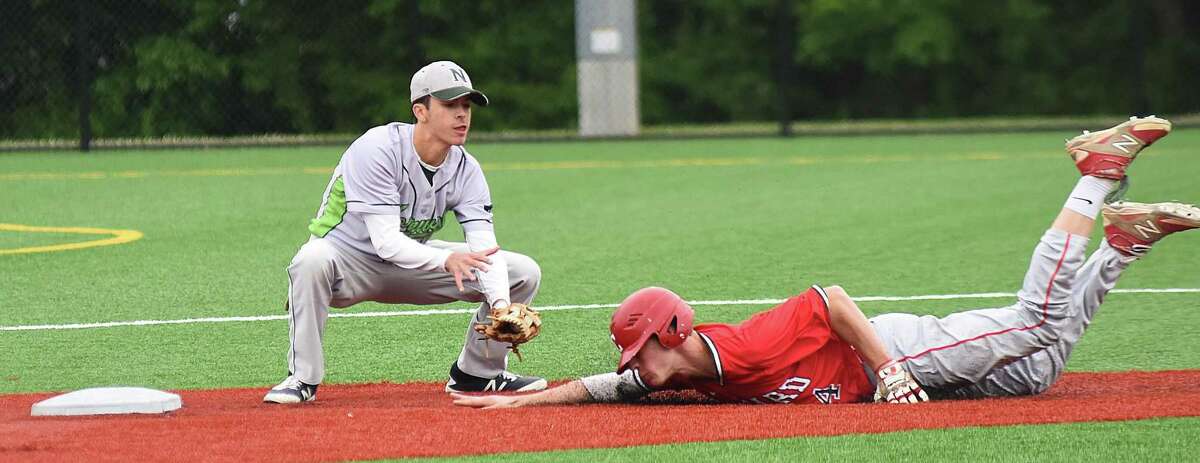 Norwalk second baseman Kyle Mossop, left, waits to put the tag on Conard baserunner Jeff LaRosa on a stolen baseball attempt in Tuesday's CIAC Class LL baseball tournament game at Norwalk. LaRosa was called safe on the play, but the call was nullified after the batter was ruled striking out for the third inning.