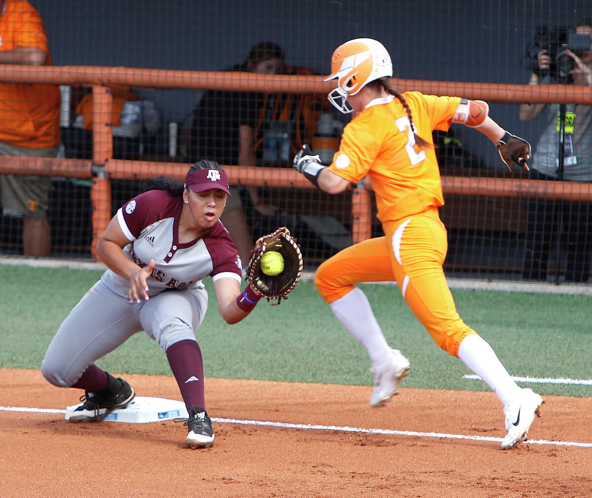 First baseman Tori Vidales, left, and A&M took a difficult route to the Women's College World Series - losing the first game of a super regional at Tennessee before beating the favored Volunteers in the next two.