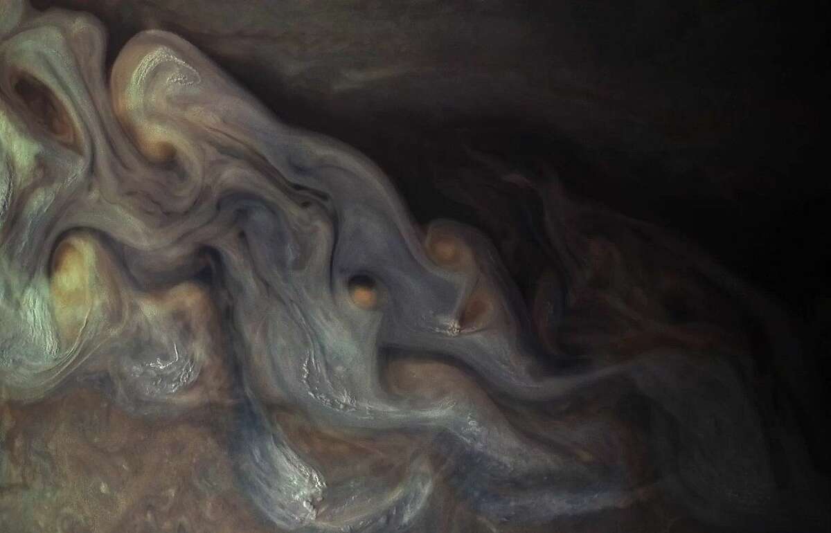 New NASA images of Jupiter show white clouds that scientists believe may produce snow or hail. Click through to see NASA's costliest space missions.