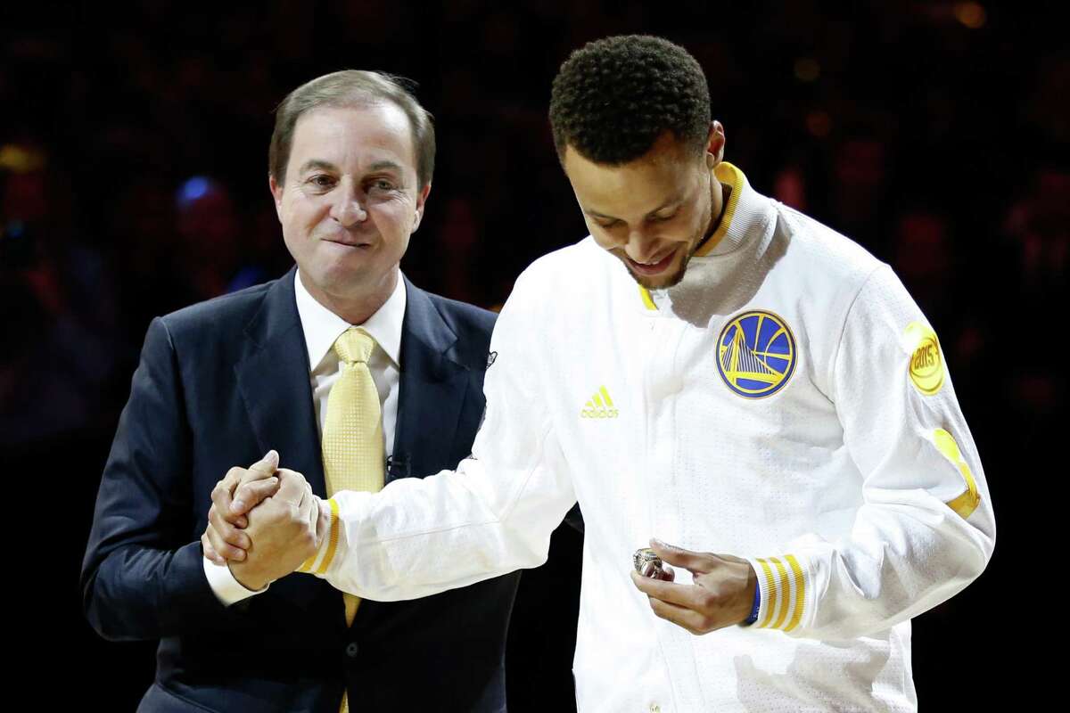 OAKLAND, CA - OCTOBER 27: Stephen Curry #30 of the Golden State Warriors receives his championship ring from owner Joe Lacob prior to their game against the New Orleans Pelicans during the NBA season opener at ORACLE Arena on October 27, 2015 in Oakland, California. NOTE TO USER: User expressly acknowledges and agrees that, by downloading and or using this photograph, User is consenting to the terms and conditions of the Getty Images License Agreement. (Photo by Ezra Shaw/Getty Images)