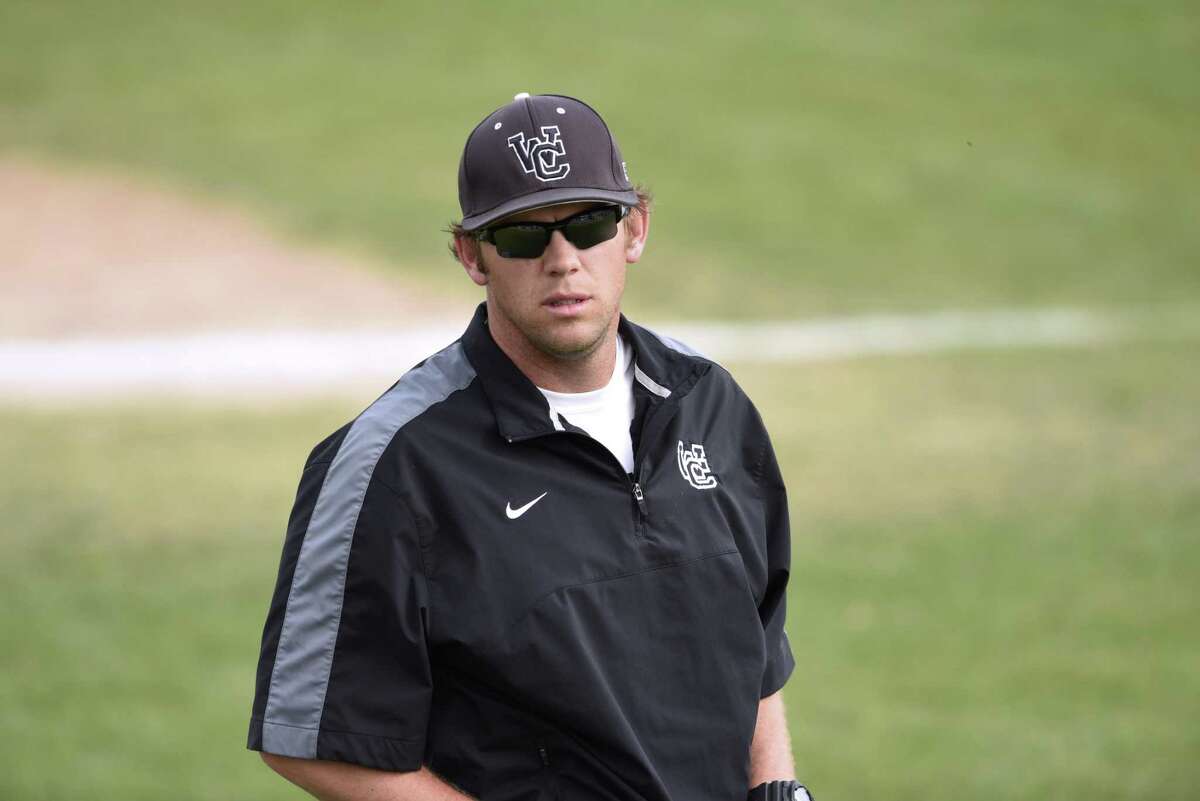 Churchill coach Alan Hill directs his team from the third-base box during a game at Blossom Athetic Center on March 16, 2016.