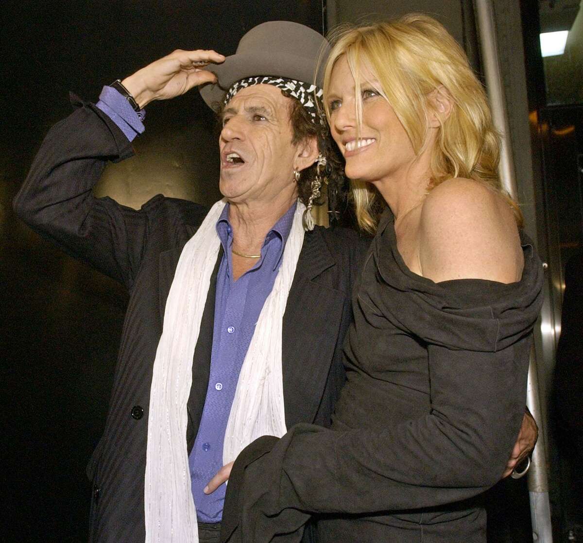 Rolling Stones' guitarist Keith Richards, left, arrives with his wife Patti Hansen at the launch party of the four DVD collection "Four Licks" Wednesday, Oct. 29, 2003 in New York.The legendary Rolling Stones guitarist and his wife, Patti Hansen, are donating items from their upper East Side Manhattan apartment to benefit Ridgefield nonprofits — SPHERE and The Prospector Theater — for the work they do with adults who have autism. The connection to the Connecticut nonprofits: Hansen’s 24-year-old-nephew has autism and has received services from the charity organization.