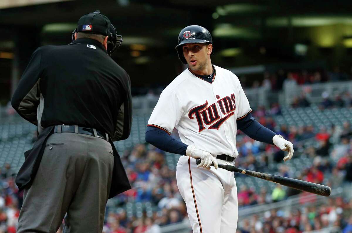 Minnesota Twins' Jason Castro questions a strike call by plate umpire Sam Holbrook in the first inning of a baseball game Tuesday, May 30, 2017 in Minneapolis. (AP Photo/Jim Mone)