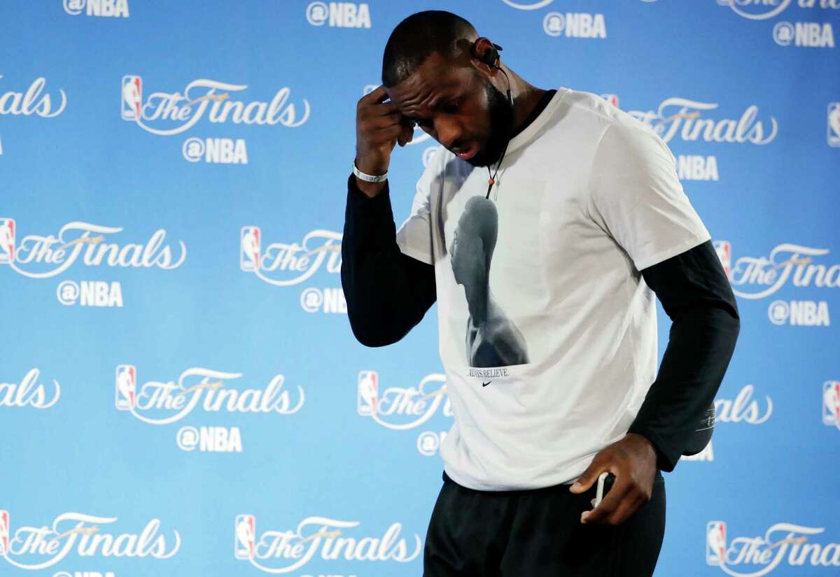 Cleveland Cavaliers' LeBron James walks up to the podium to answer questions before an NBA basketball practice, Wednesday, May 31, 2017, in Oakland, Calif. The Cavaliers face the Golden State Warriors in Game 1 of the NBA Finals on Thursday in Oakland. (AP Photo/Marcio Jose Sanchez)