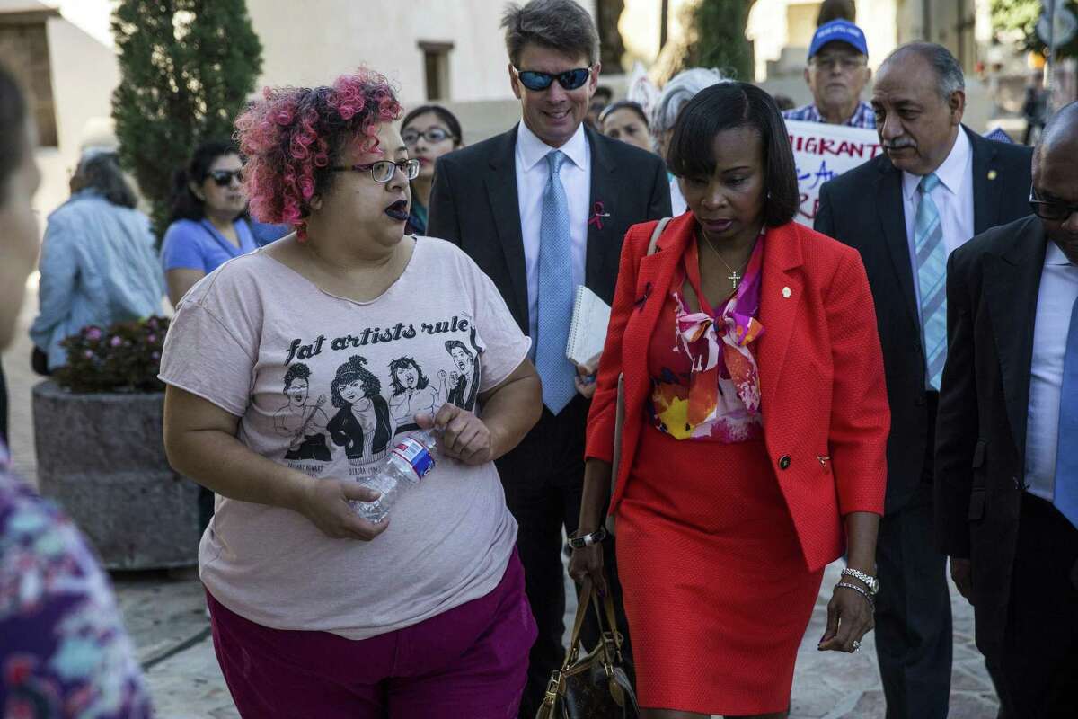 Barbie Hurtado, a community organizer wth RAICES, speaks with Mayor Ivy Taylor during a demonstration to ask the city to file a lawsuit against S.B. 4 at the Municipal Plaza building in San Antonio, Texas on May 25, 2017. Ray Whitehouse / for the San Antonio Express-News