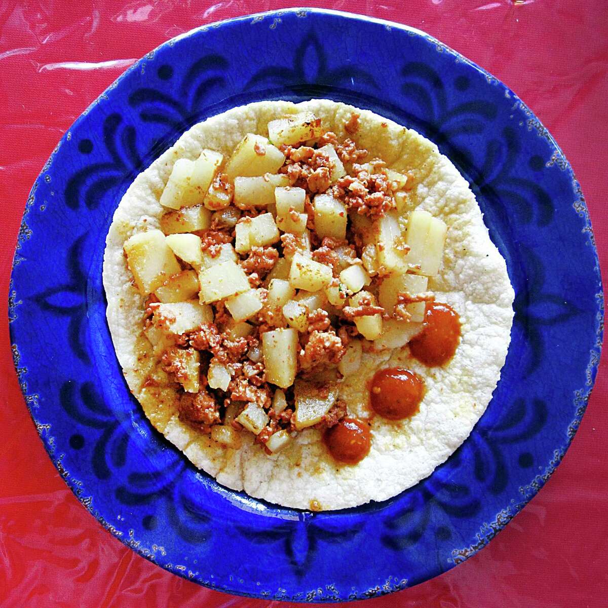 Chorizo and potato taco on a handmade corn tortilla from Taqueria Rello.