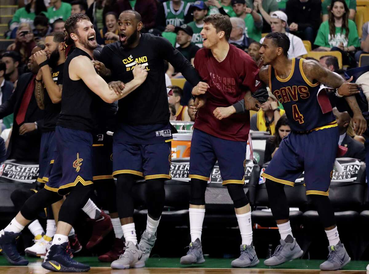Cleveland Cavaliers, from left, Kevin Love, LeBron James, Kyle Korver and Iman Shumpert celebrate a basket during the second half of Game 5 of the NBA basketball Eastern Conference finals against the Boston Celtics, on Thursday, May 25, 2017, in Boston. (AP Photo/Elise Amendola)