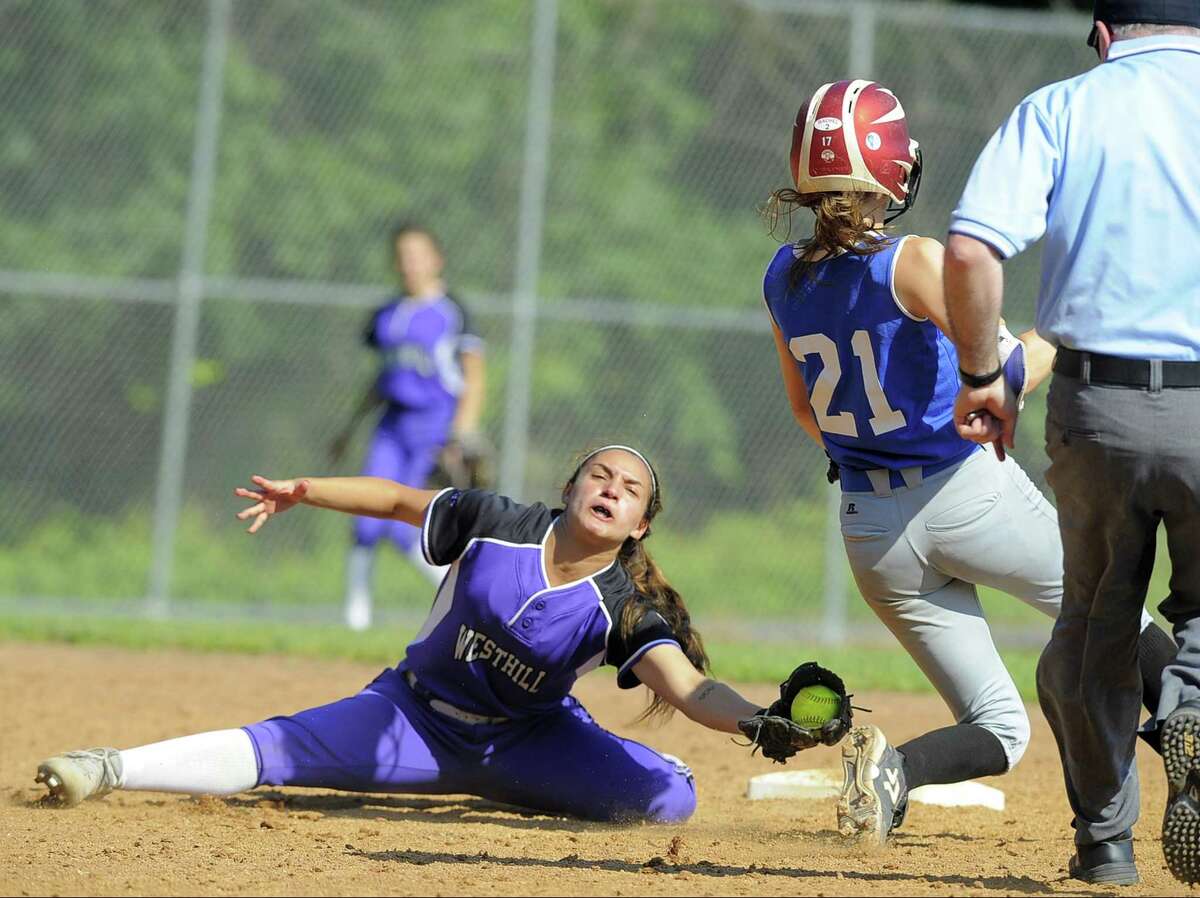 Glastonbury Julia Karnes avoids the tag from Westhill Gabby Laccona on a thrid innigs stolen base in a second round CIAC Class LL softball game at Westhill High School in Stamford, Conn. on Tuesday, May 31, 2017. Westhill defeated Glastonbury 3-2.