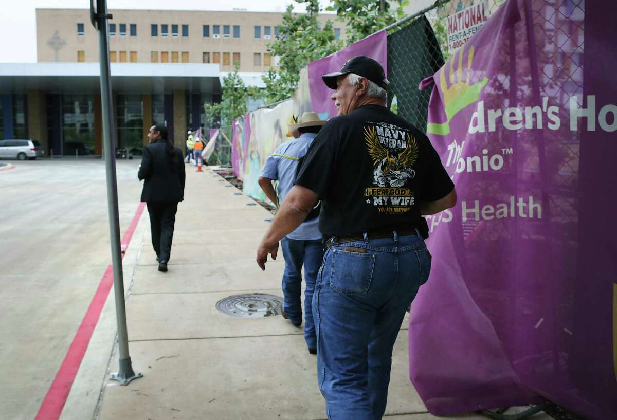 Various descendants of San Antonio's first families, including Raymond Hernandez, right, and Ramon Vasquez, left, arrive at The Children's Hospital of San Antonio on Wednesday, May 31, 2017, for a meeting with officials from the hospital. Many members of the city's first families were interred at a campo santo and larger Catholic cemetery underneath Children's Hospital of San Antonio.