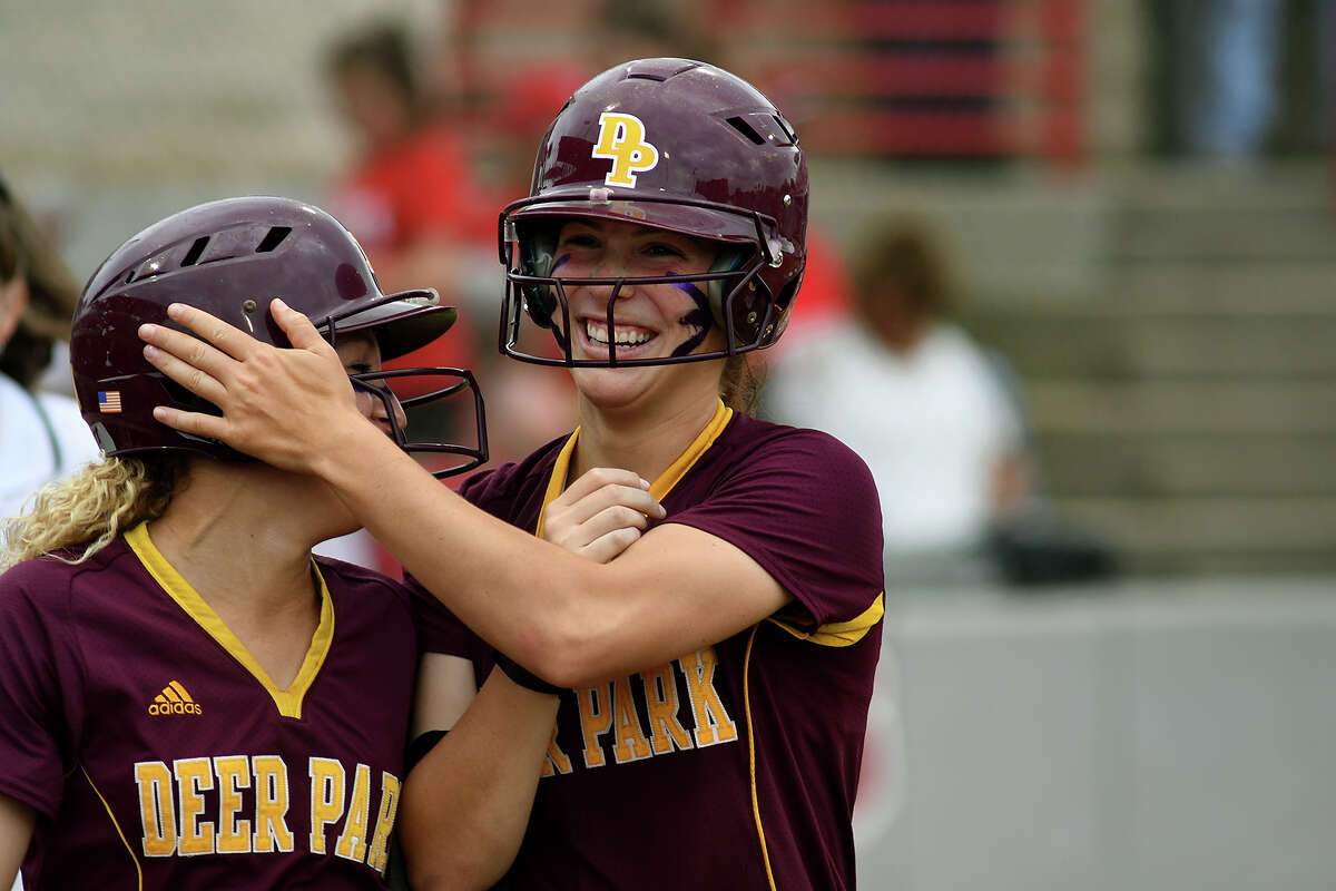 Deer Park senior Erin Edmoundson, right, celebrates her 3-run homerun in the top of the 5th inning with senior first baseman Alyssa Hernandez who scored in front of Edmoundson against Katy in game two of their Class 6A Region III final series at Cougar Softball Stadium on the campus of the University of Houston on Friday, May 26, 2017. (Photo by Jerry Baker/Freelance)