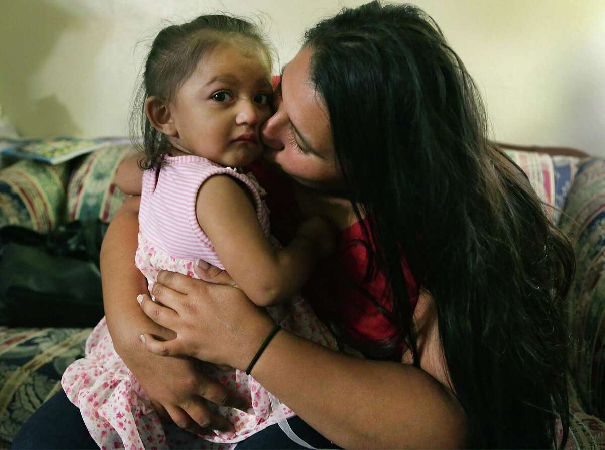 Yolanda Aldana, 27, a former addict and mother of three, sits with 1-year-old daughter Nevaeh last month. Aldana, who has been clean for two years, is working to help expectant moms with drug addictions. Such outreach — instead of punitive policies — better serve women at risk of giving birth to addicted babies.