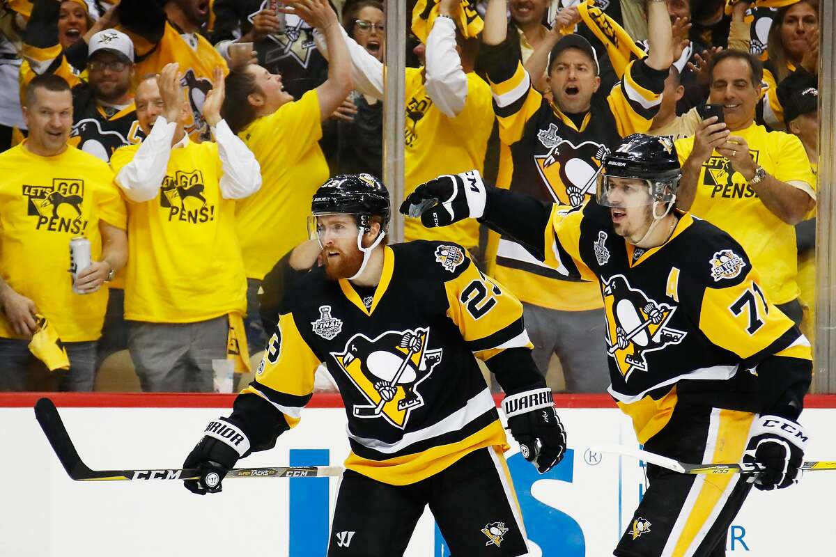 PITTSBURGH, PA - MAY 31: Scott Wilson #23 of the Pittsburgh Penguins celebrates with Evgeni Malkin #71 after scoring a goal during the third period in Game Two of the 2017 NHL Stanley Cup Final against the Nashville Predators at PPG Paints Arena on May 31, 2017 in Pittsburgh, Pennsylvania. (Photo by Gregory Shamus/Getty Images)