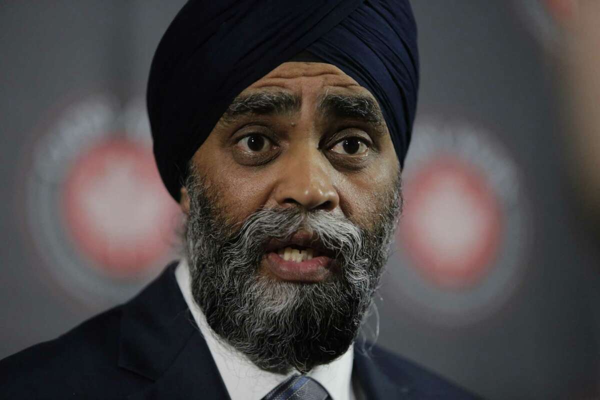 Harjit Sajjan, Canada's defense minister, speaks with members of the media during the CANSEC 2017 trade show in Ottawa, Ontario, Canada, on Wednesday, May 31, 2017. The Canadian Association of Defence and Security Industries (CADSI) annual two day trade show exhibits technology, products, and services from companies throughout the defense industry, with attendees representing military leadership, government officials and over 65 foreign delegations. Photographer: David Kawai/Bloomberg