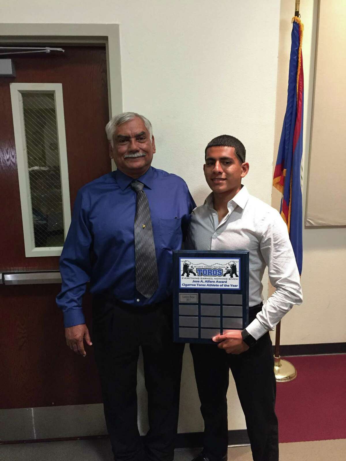 Cigarroa's Jose Alfaro, left, was honored with an award in his name on Tuesday at Cigarroa’s football banquet. The ‘Jose Alfaro Award’ will be given to the most outstanding CHS athlete each and every year. Leeroy Raya, right, is the first Toro to earn the award.