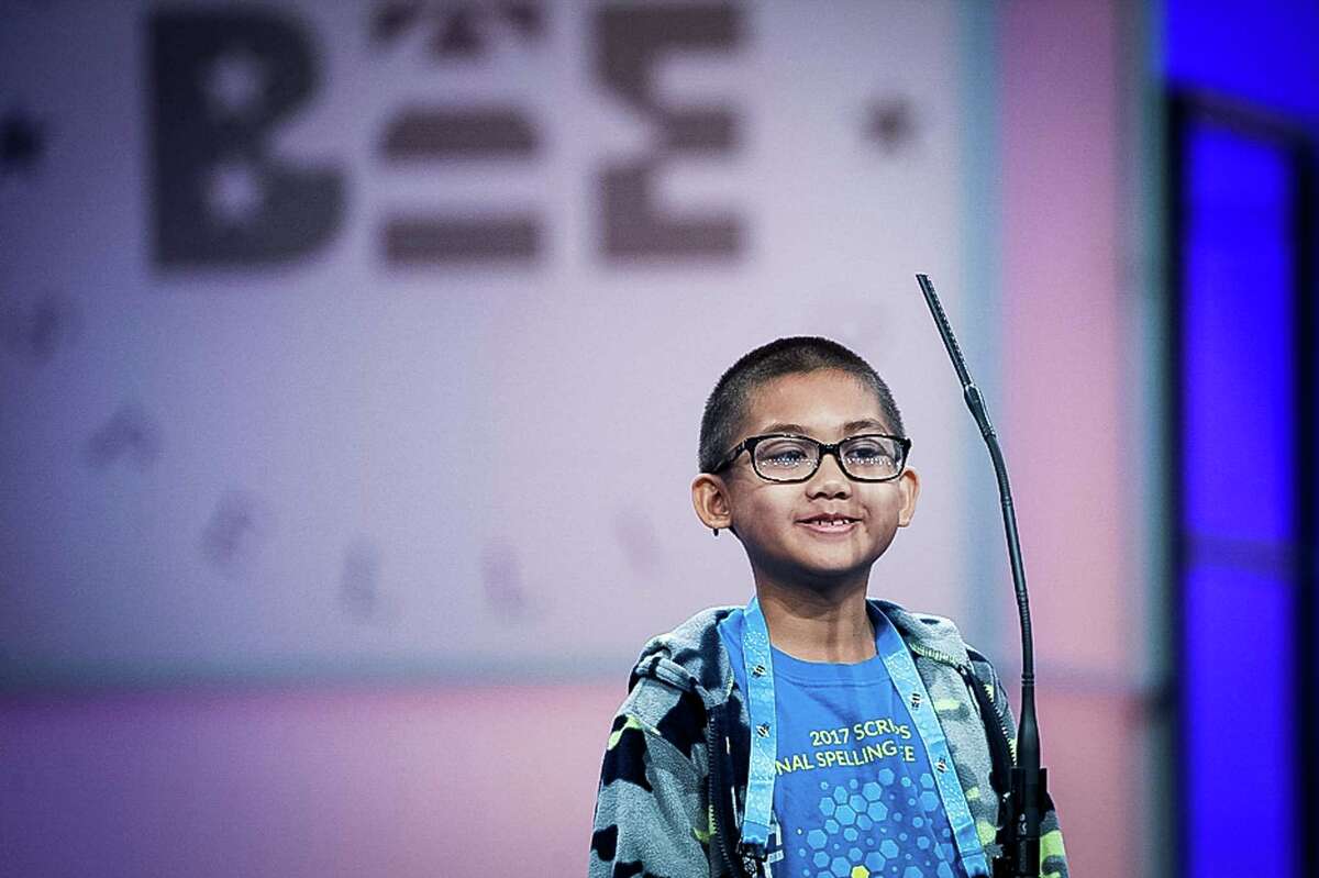 Emmanuel Rimocal, 9, of Laredo, Texas, spells his word in the 90th Scripps National Spelling Bee in Oxon Hill, Md., Wednesday, May 31, 2017.