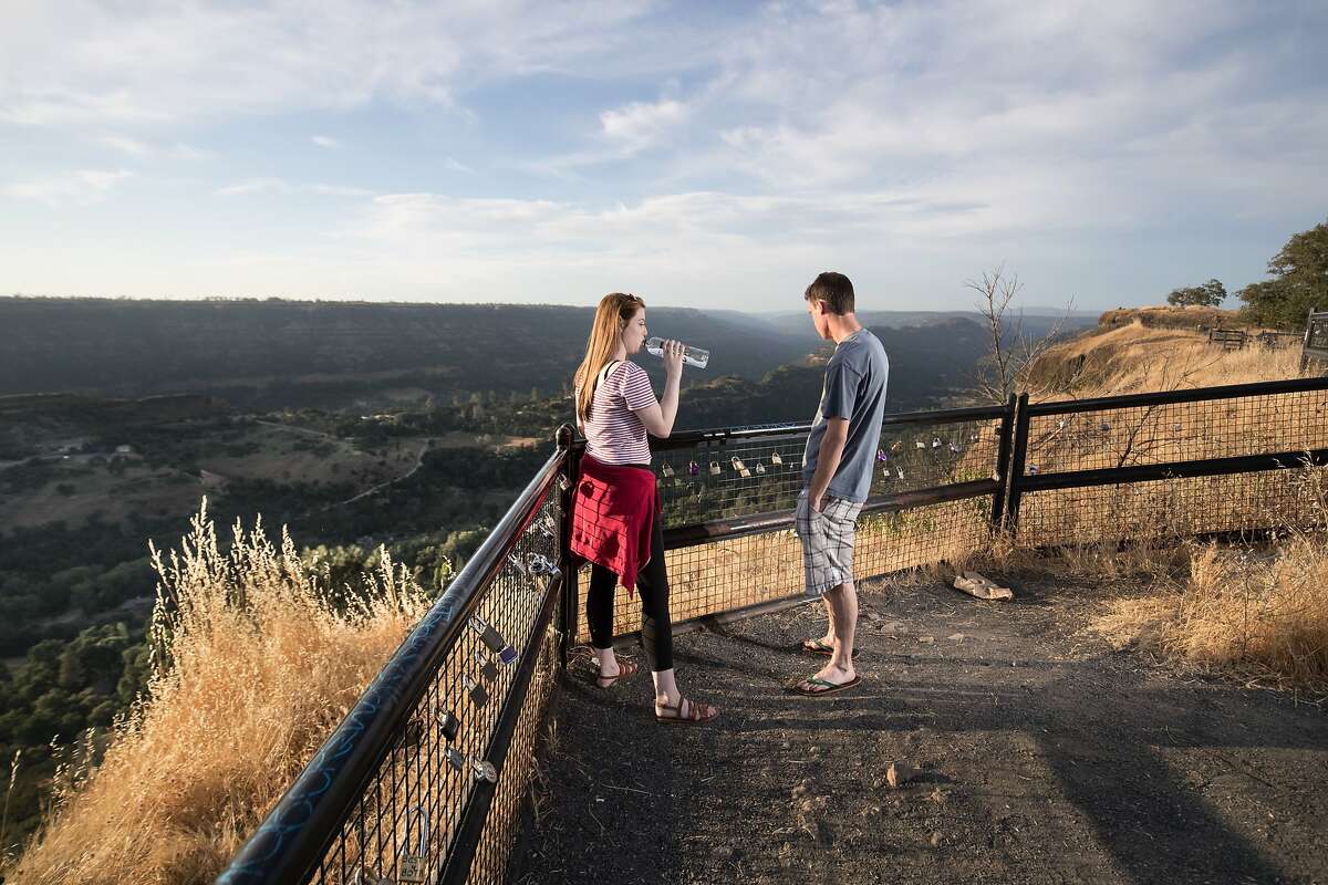 Courtney Isles and Will Reed at a canyon lookout point on Skyway in Paradise on Monday, May 29 2017 in Butte County, CA.