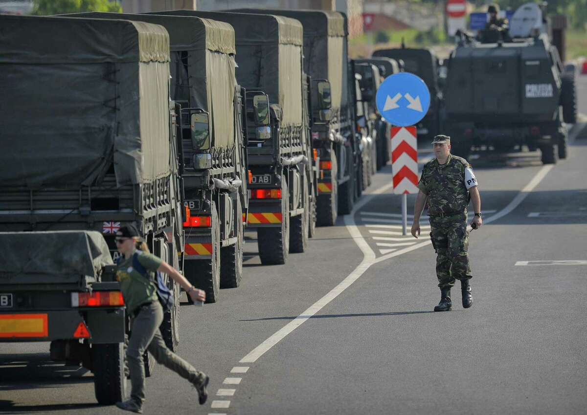 British troops arrive in Romania after crossing the border from Bulgaria in Giurgiu, Romania, Thursday, June 1, 2017 to take part in the alliance's Noble Jump 2017 exercise which tests the readiness of alliance troops. Some 2,000 troops and more than 500 vehicles will head to the Cincu training area in central Romania from bases in Britain, Germany, the Netherlands, Spain, Poland, Norway and Albania, joining around 2,000 Romanian troops and over 1,000 enablers.(AP Photo/Vadim Ghirda)