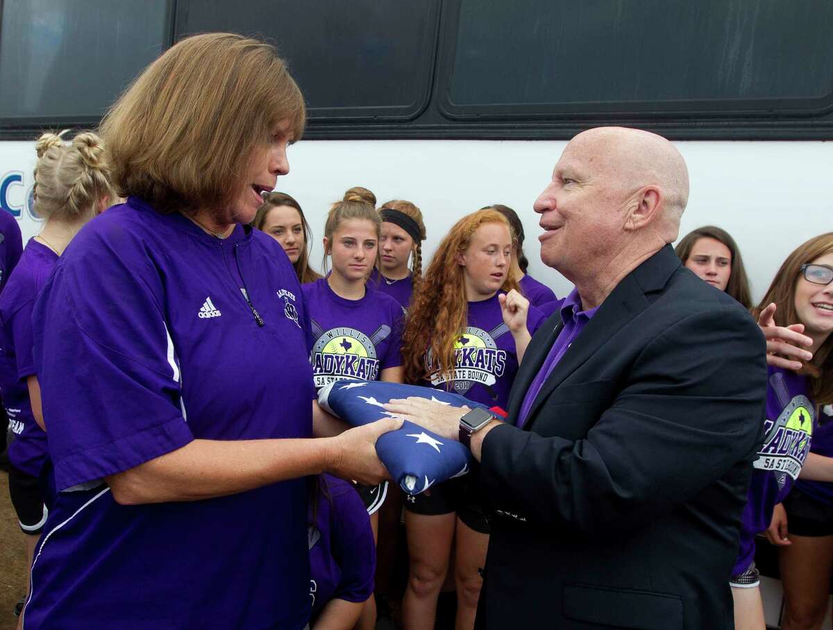 U.S. Rep. Kevin Brady, R-The Woodlands, presents an American flag to head coach Stephanie Shelly during a send-off for the Willis High School softball team Thursday, June 1, 2017, in Willis.