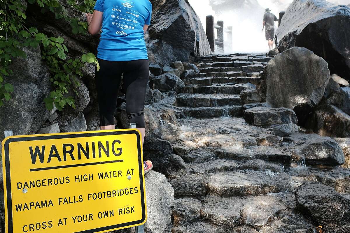 A sign warns that crossing the Wapama Falls Footbridges can be dangerous.