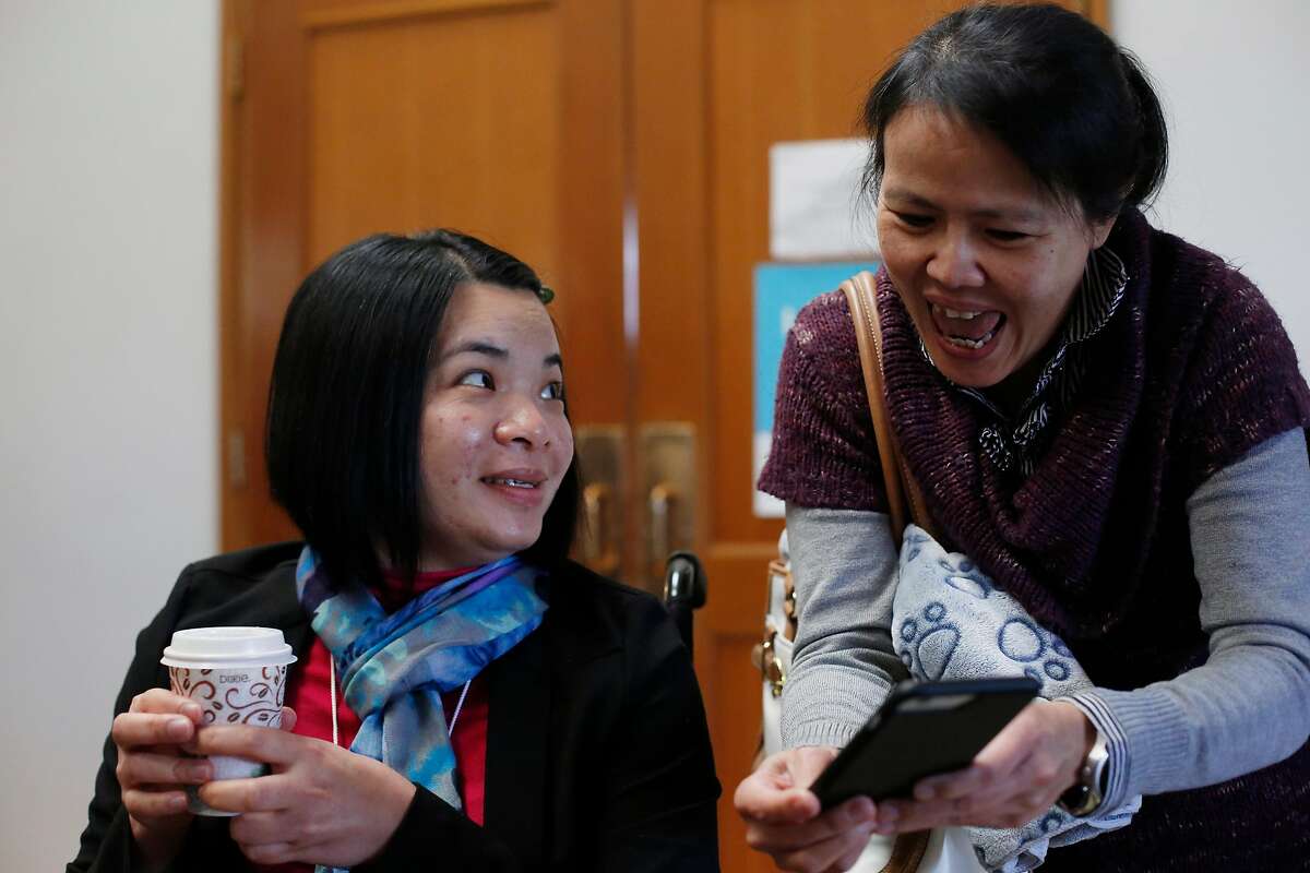 Emma Zhou (l to r) catches up wtih friend Jessica Chang during a visit to Myoshinji Temple with her family on Sunday, March 19, 2017 in San Pablo, Calif.