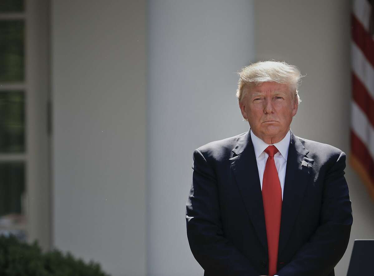 President Donald Trump stands next to the podium after speaking about the U.S. role in the Paris climate change accord, Thursday, June 1, 2017, in the Rose Garden of the White House in Washington. (AP Photo/Pablo Martinez Monsivais)