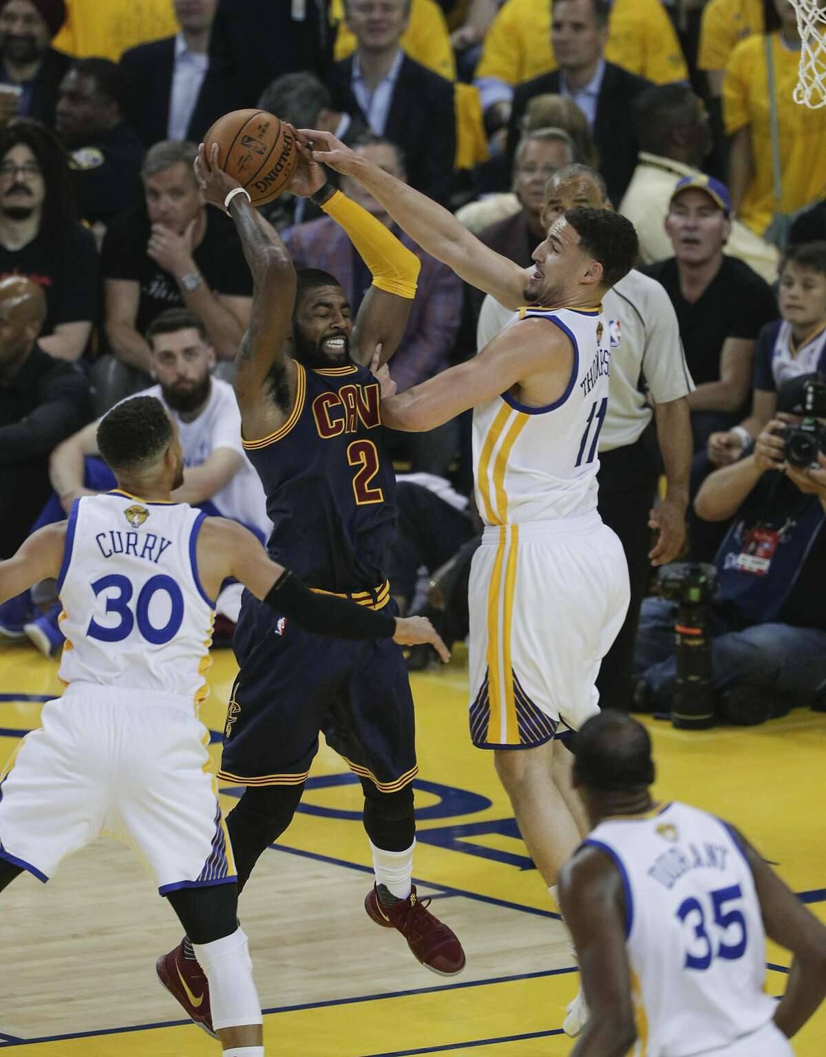 Golden State Warriors' Klay Thompson defends against Cleveland Cavaliers' Kyrie Irving in the first quarter during Game 1 of the 2017 NBA Finals at Oracle Arena on Thursday, June 1, 2017 in Oakland, Calif.