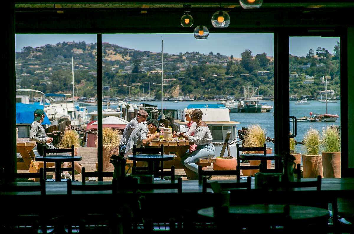 People have lunch on the deck at Joinery in Sausalito, Calif., on June 1st, 2017.