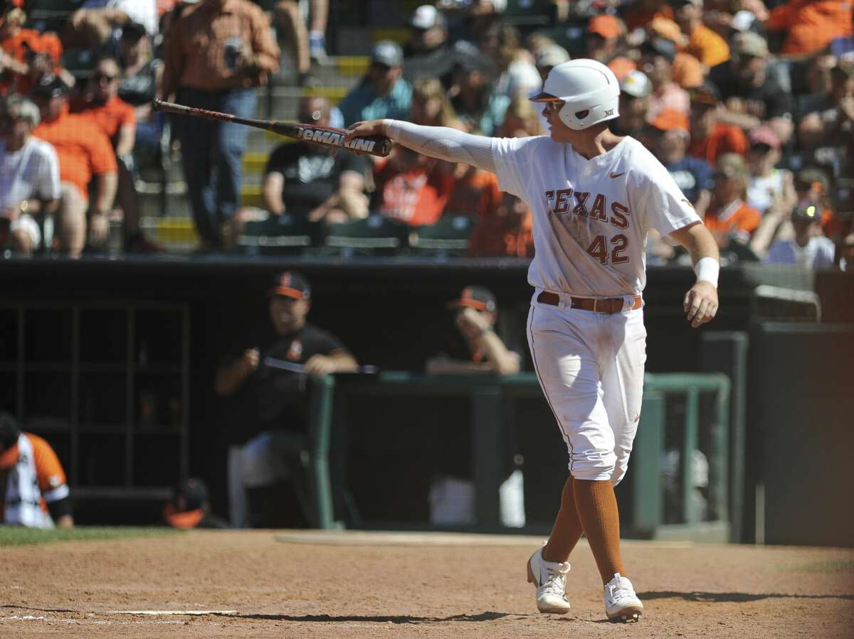Texas' Kacy Clemens celebrates after scoring a run in the championship game in the Big 12 baseball tournament in Oklahoma City, Sunday, May 28, 2017. (AP Photo/Kyle Phillips)