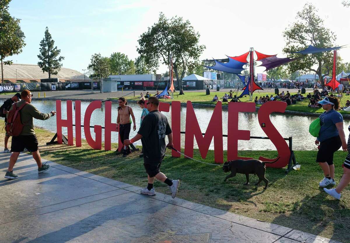 FILE - In this Sunday, April 23, 2017, file photo, visitors arrive at the fairgrounds to attend the High Times Cannabis Cup in San Bernardino, Calif. High Times, the magazine that for decades has been the go-to bible for backyard pot growers and cocktail party tokers has been sold to a group of investors that includes reggae musician and ganga guru Damian Marley. The son of the late reggae superstar Bob Marley is one of 20 investors who acquired a 60 percent stake in High Times, its digital media platforms and its increasingly popular Cannabis Cup trade shows. (AP Photo/Richard Vogel, File)