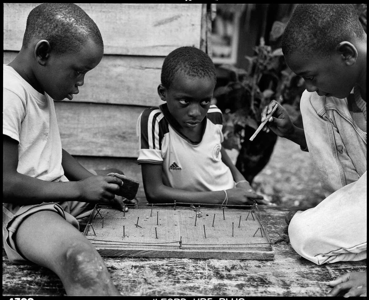 "Buenaventura, Colombia, 2015:" Children in Puente Nayero play an improvised game of table football.