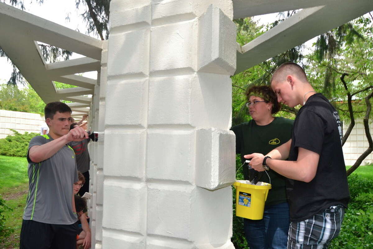 Photo provided Students painted the Unit Block 'grape vine wall' in the inner courtyard of the Home and Studio.