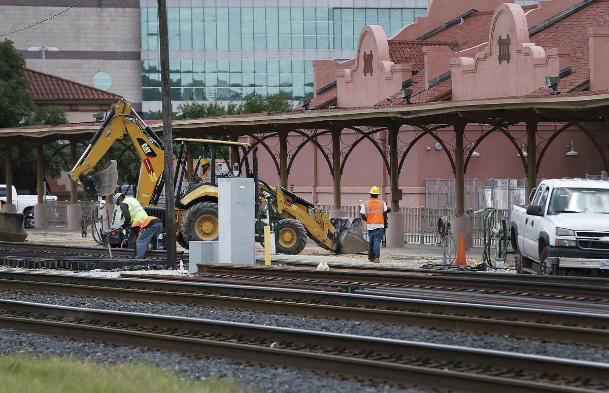 Crews work on a portion of the train tracks at Sunset Station on Thursday, June 1, 2017. County Judge Nelson Wolff is thinking about a passenger rail line going from The Rim to Martin St. at Interstate 35, using existing freight line tracks owned by Union Pacific. (Kin Man Hui/San Antonio Express-News)