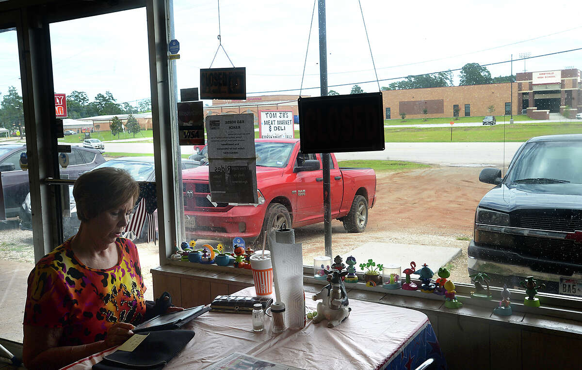 A customer sits at one of the dine-in tables at Tom Jr.'s Meat Market & Deli, which is located across the highway from Kirbyville High School. Residents of the town, as well as city and school district officials, continue to grapple with the repercussions of the death of high school principal Dennis Reeves. Reeves committed suicide last Tuesday hours after being forced to resign in the light of allegations of an affair involving a former secretary. A petition began circulating online Wednesday night demanding that Kirbyville CISD Superintendent Thomas Wallis be removed from the office due to what petitioners claim was a mishandling of the situation that has hurt the community. Photo taken Thursday, June 1, 2017 Kim Brent/The Enterprise